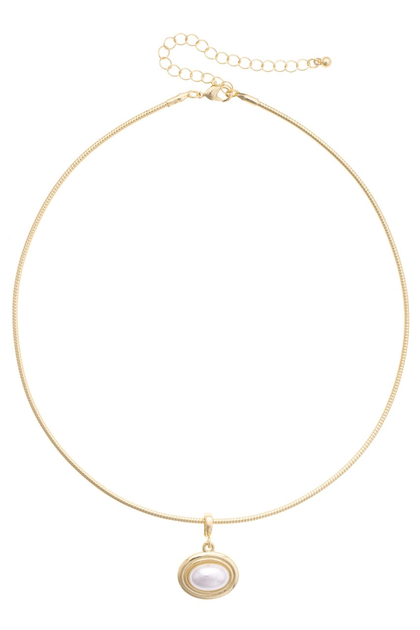 Gold necklace with a pendant on a white background