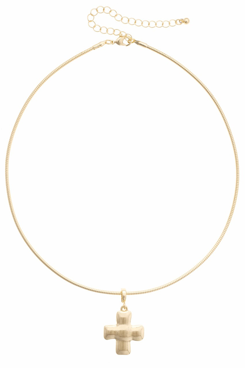 Gold necklace with a cross pendant on a white background