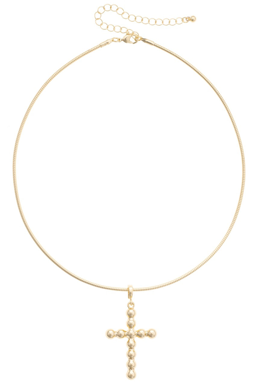 Gold necklace with a cross pendant on a white background
