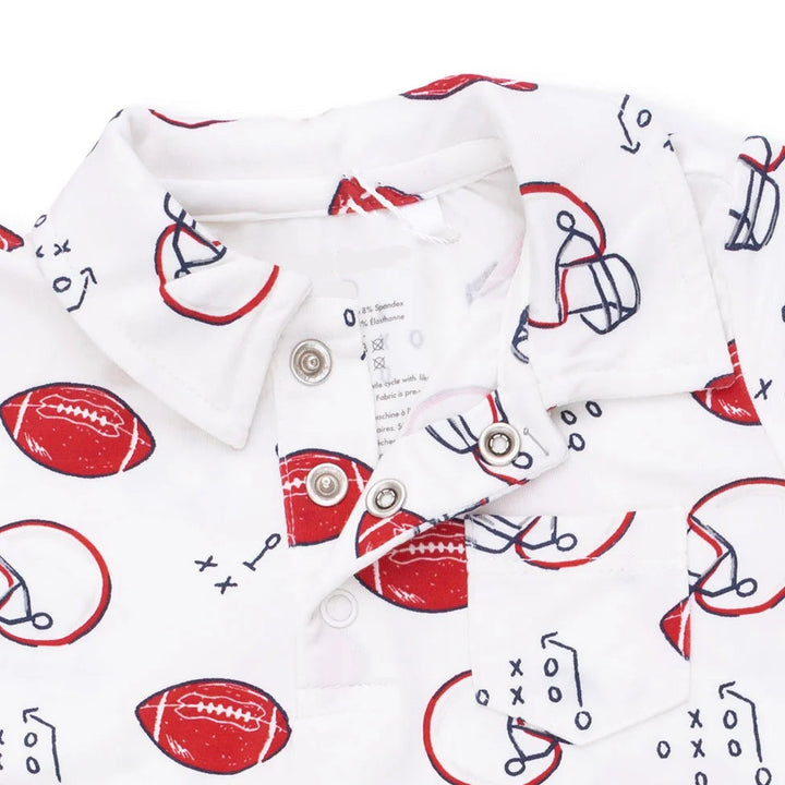 Angel Dear Touchdown Time Polo Romper close-up of the baby romper highlighting the print, closures, and finishing details