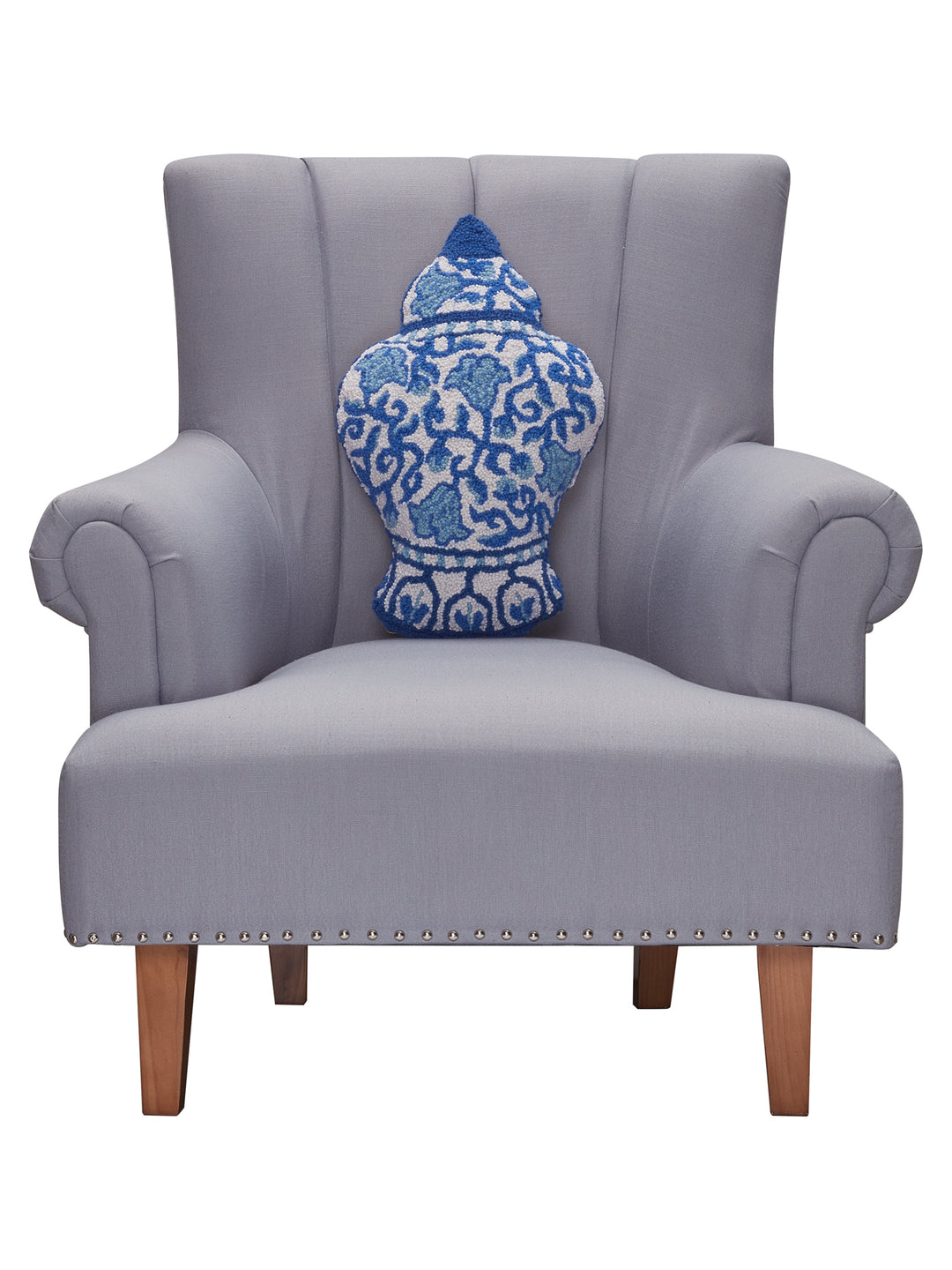 STYLED SHOT OF CHINOISERIE VASE SHAPED PILLOW ON GRAY CHAIR
