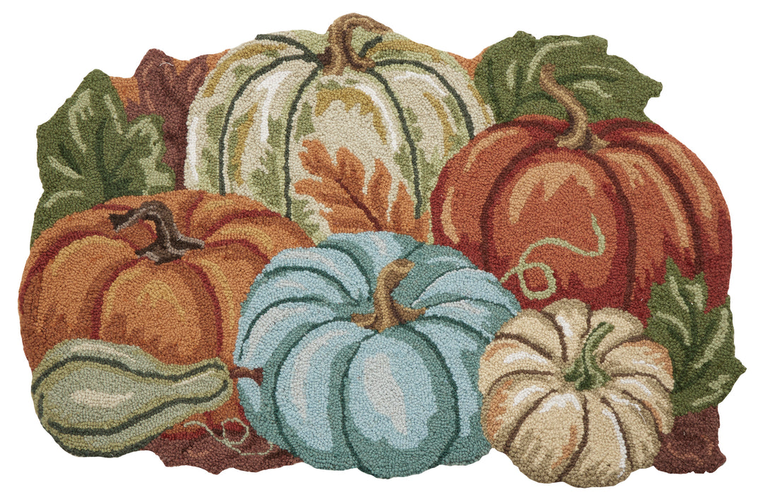 Decorative rug with colorful pumpkins and gourds on a white background