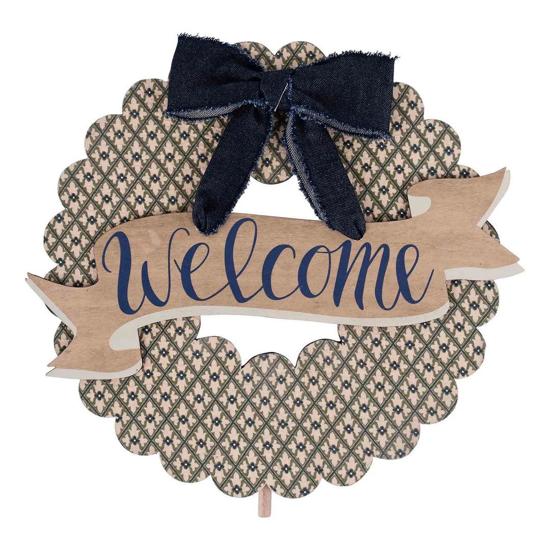 Scalloped welcome door hanger with a blue floral pattern, wooden welcome banner, and navy bow | Walker Boutique