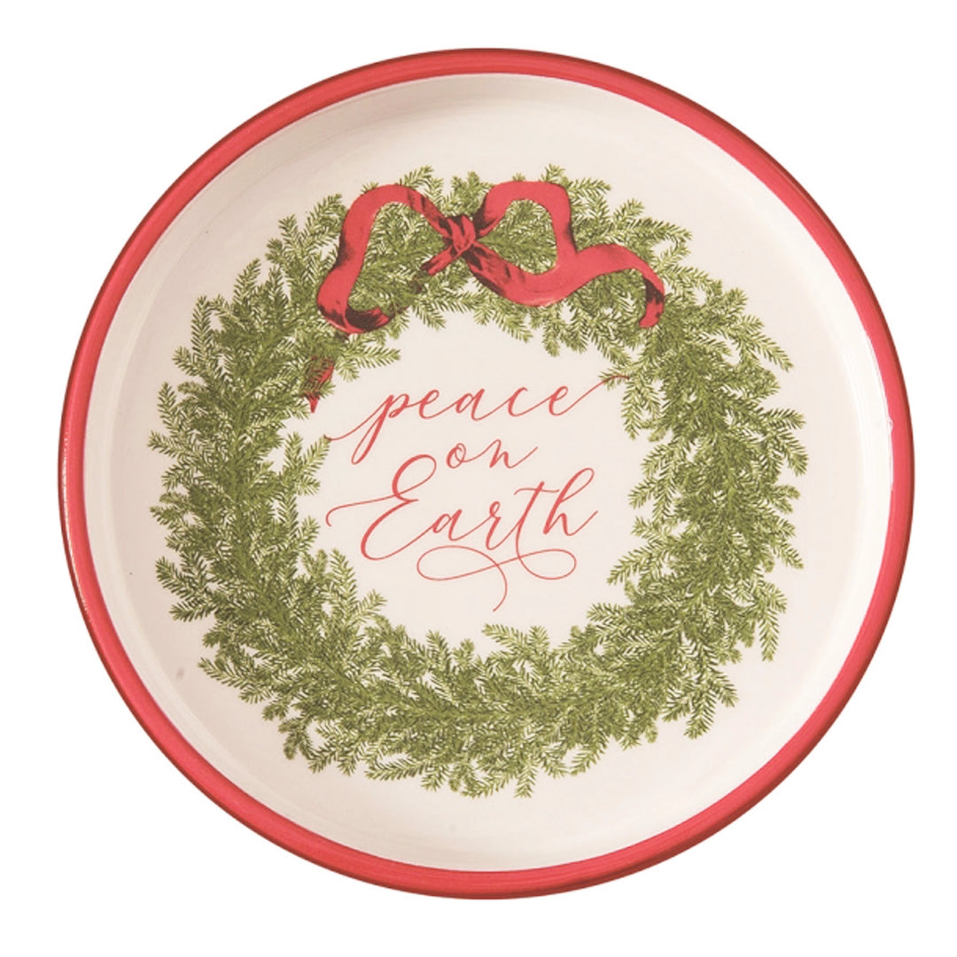 Decorative plate with Christmas wreath and 'peace on Earth' text on a white background
