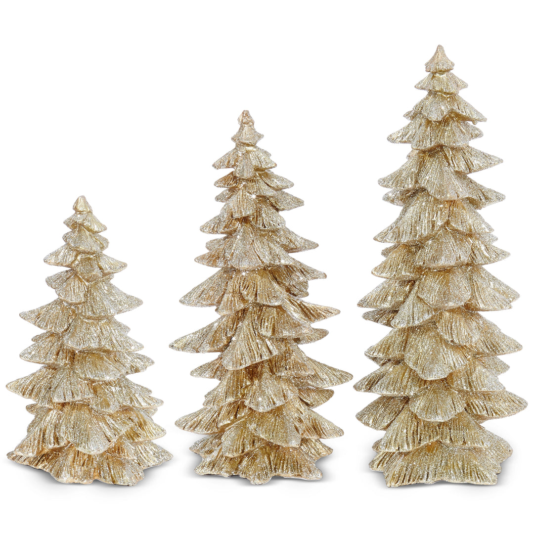 Set of three gold Christmas trees on a white background