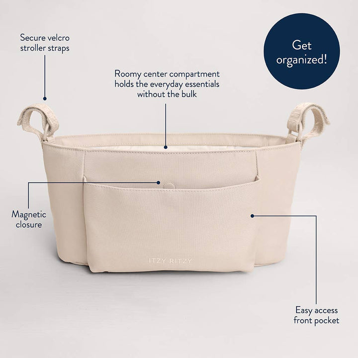A beige fabric baby stroller organizer insert shown on a light gray background with callout lines and text explaining features like secure velcro stroller straps, magnetic closure, roomy center compartment, and easy access front pocket. A dark blue circle says 'Get organized!'.