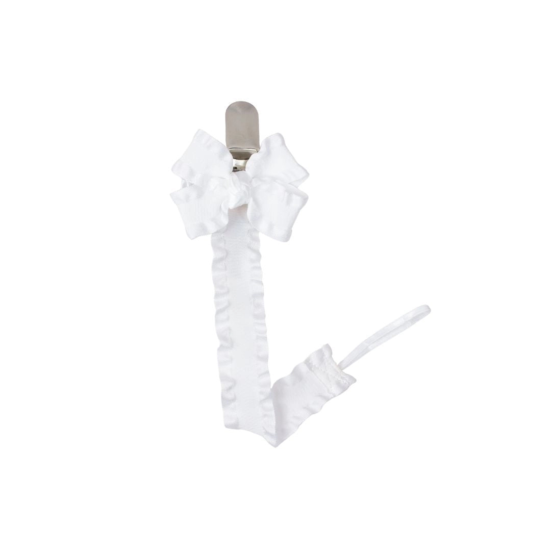 White ruffled ribbon with a clip on a white background