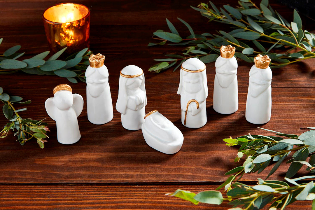 7-piece stoneware Nativity figurine set with electroplate detail. Comes with kraft barn gift box.