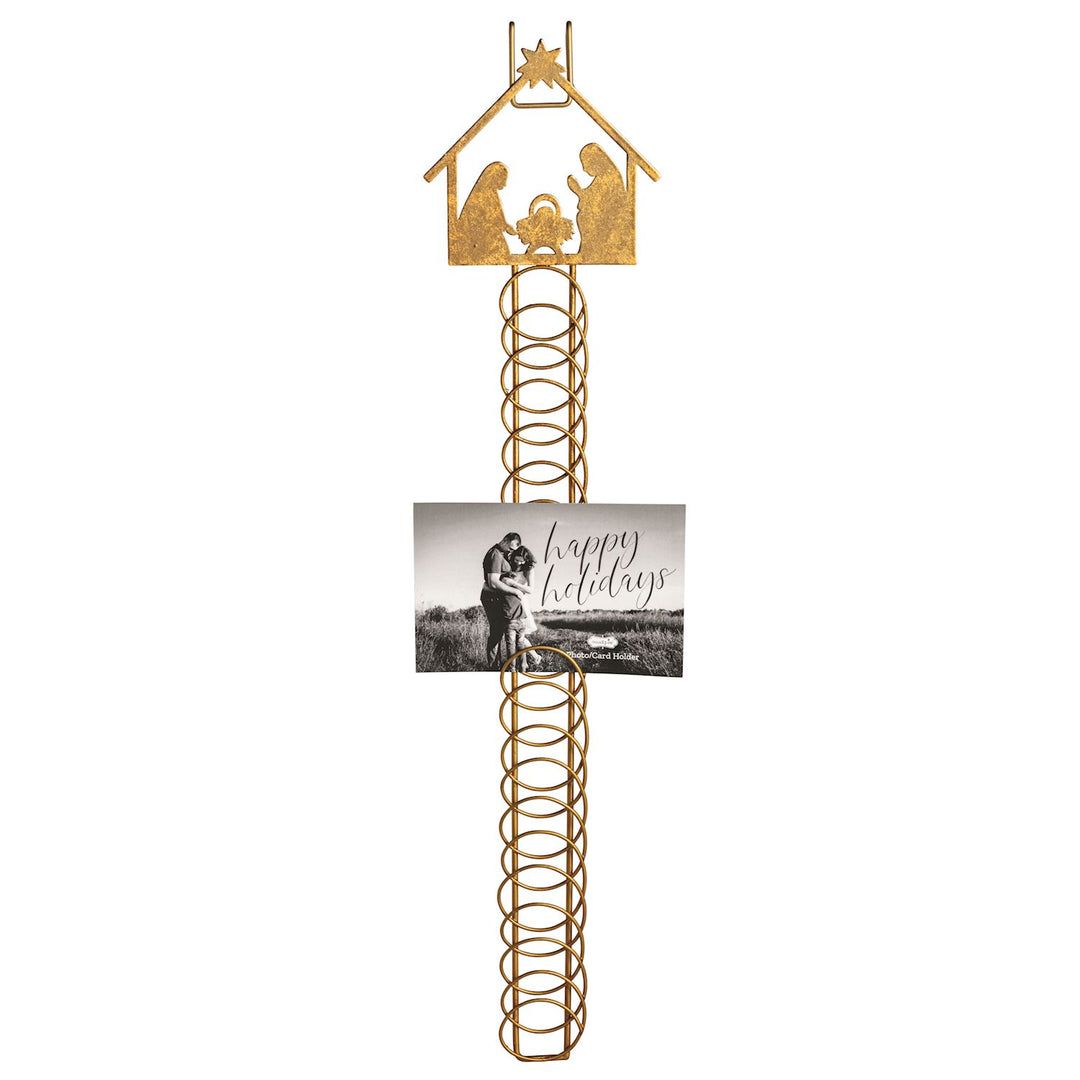 Gold metal coil Christmas card holder features foiled tin Nativity scene topper.