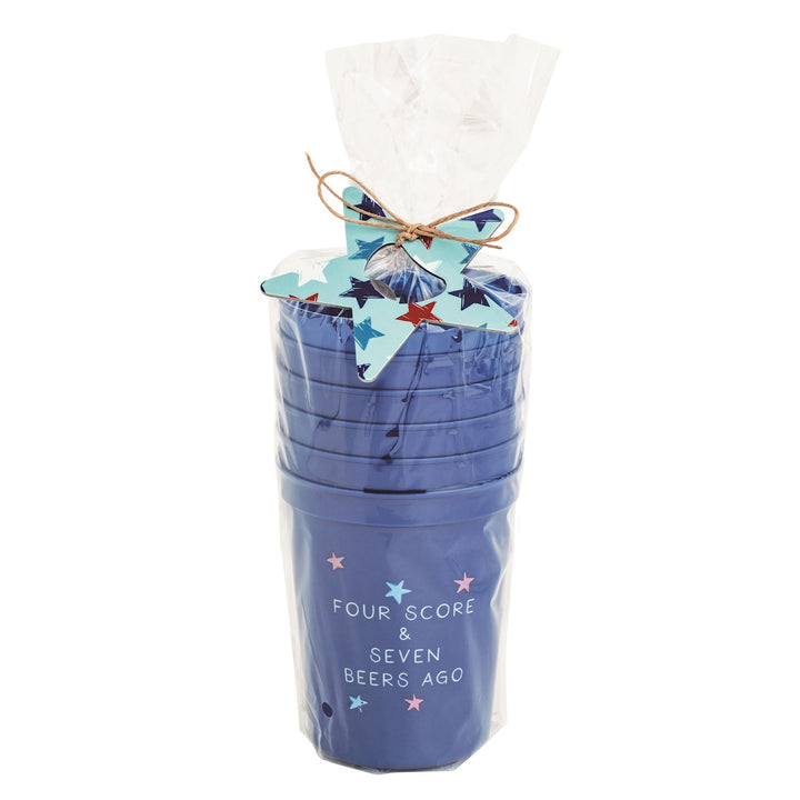 Blue reusable party cup set with “Four Score & Seven Beers Ago” patriotic lettering, wrapped in cello with red, white, and blue star bottle opener