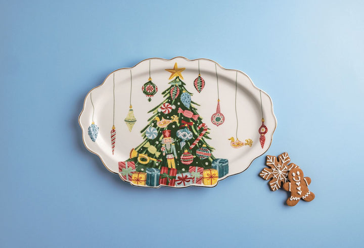 Decorative plate with a Christmas tree design on a blue background