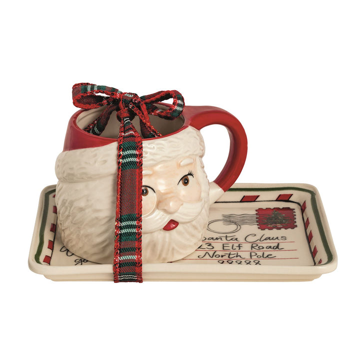 2-piece set. Stoneware "postcard" tray with hand-painted edge. Comes with coordinating Santa mug.
