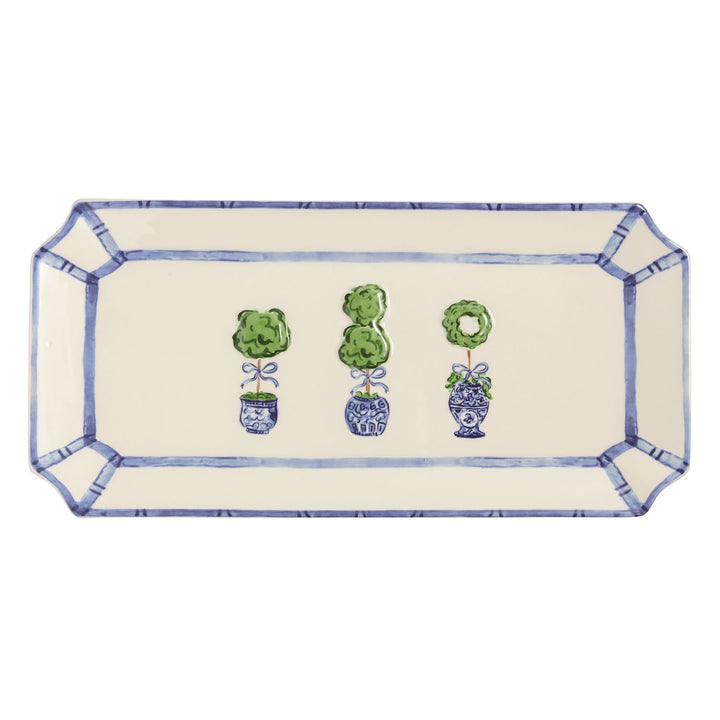 Blue and white rectangular serving platter with hand-painted chinoiserie topiary trees in decorative ginger jars and geometric border trim