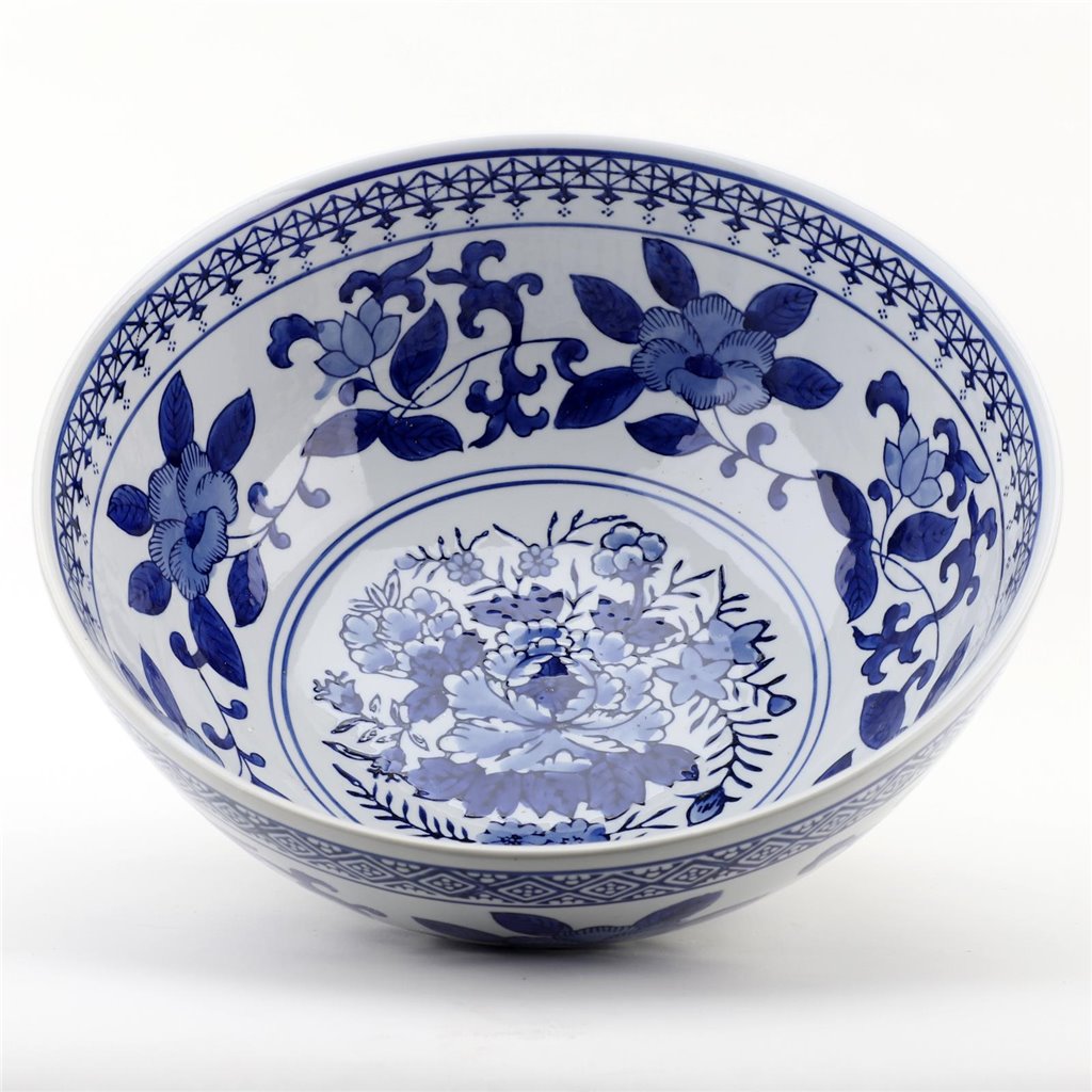 A blue and white porcelain bowl featuring a central floral motif and intricate floral patterns around the rim, shown on a clean white background.