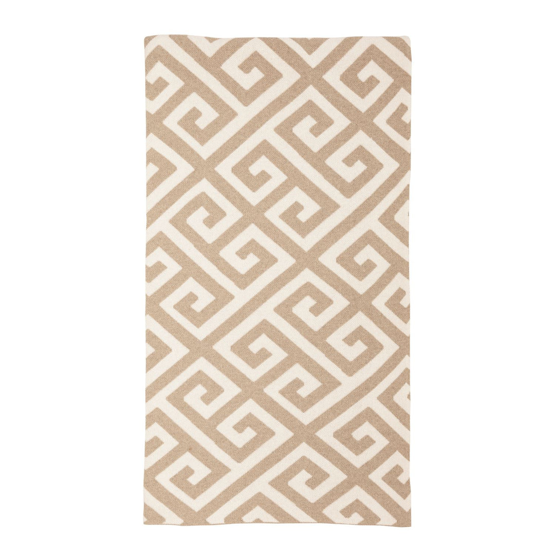 Neutral throw blanket featuring an all-over Greek key pattern, styled on a sofa for classic home décor.