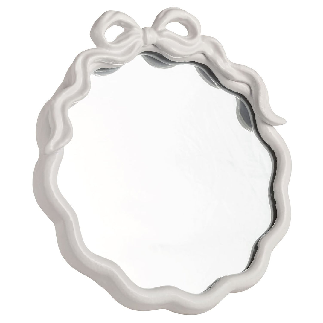 White framed mirror with bow at the top