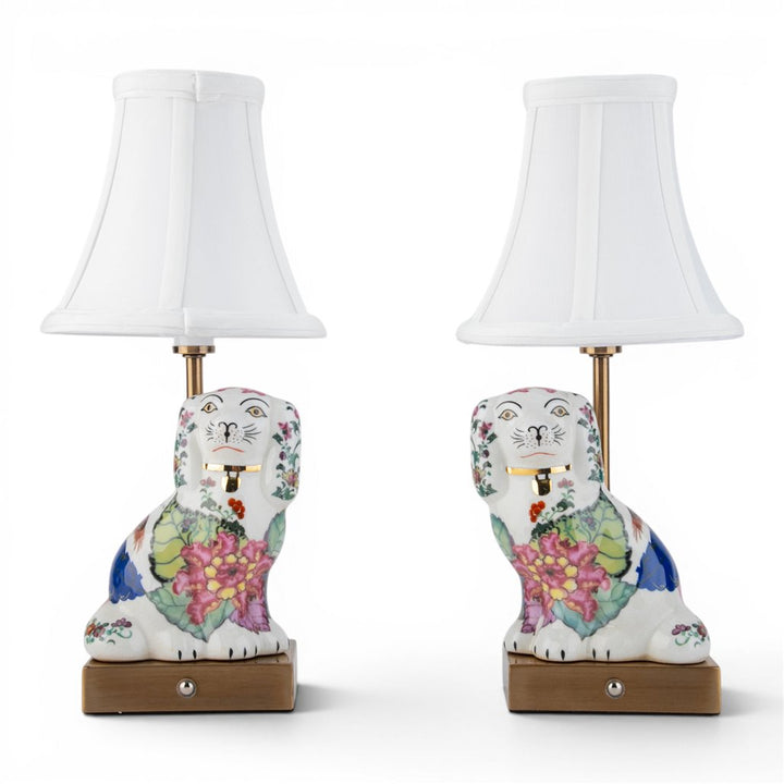 Pair of floral ceramic dog table lamps with white shades shown from the front | Walker Boutique