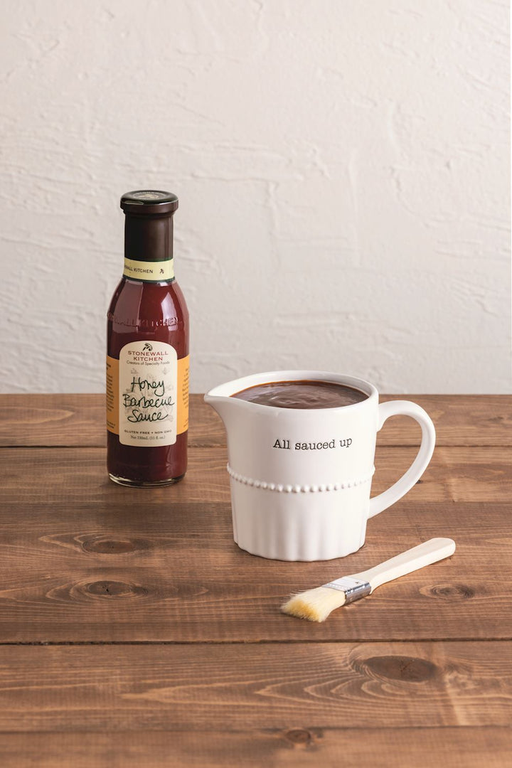 textured ceramic barbecue sauce pitcher comes with wooden basting brush and Stonewall Kitchen Honey Barbecue Sauce.