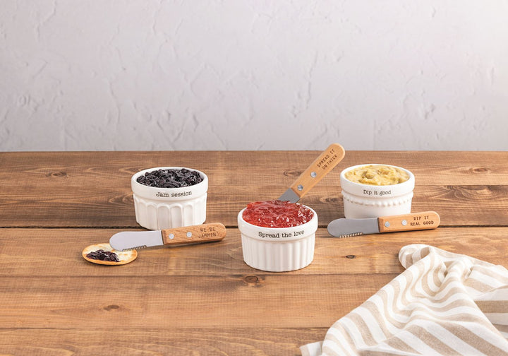 THREE DIFFERENT CERAMIC DISHES ON WOODEN TABLE WITH DIPS