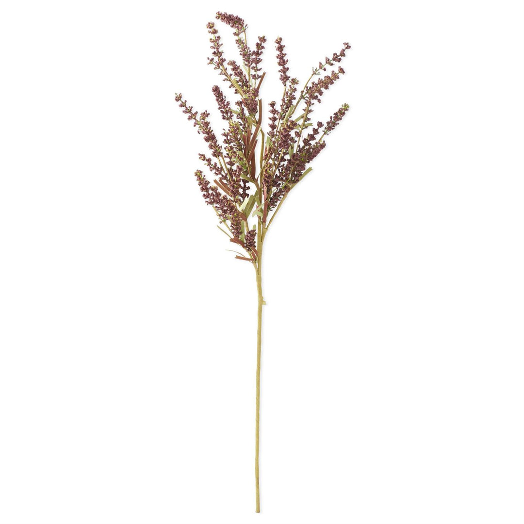 A single artificial ornamental grass stem with dark burgundy-brown feathery flower clusters and a long light tan stem, isolated on a white background.
