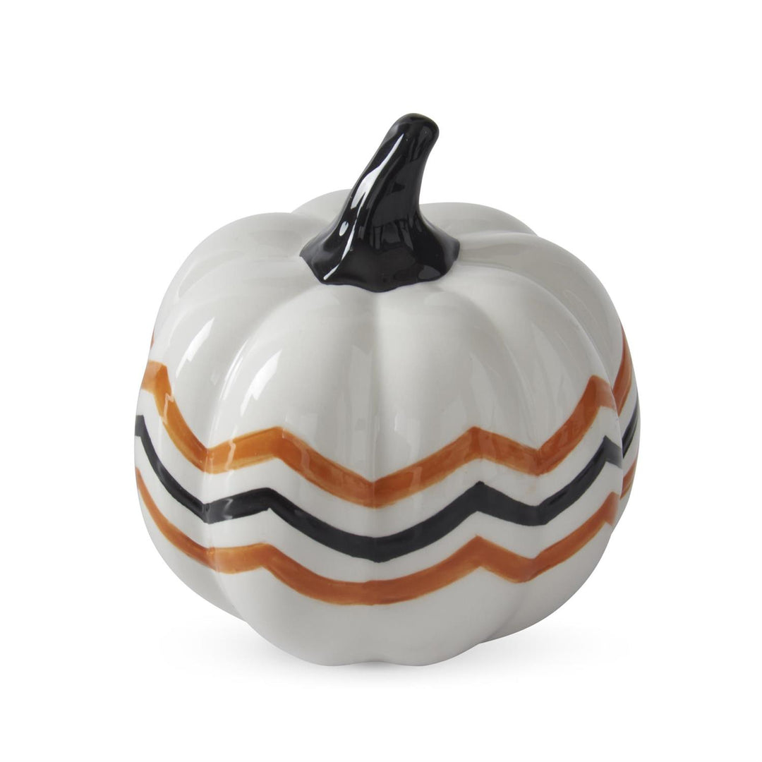 Decorative pumpkin with orange and black stripes on a white background
