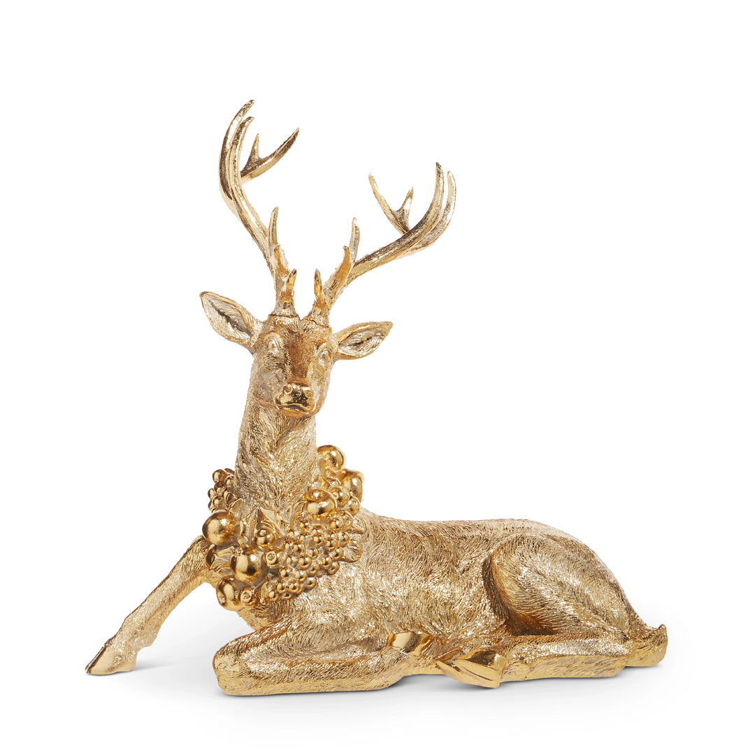Gold deer figurine on a white background