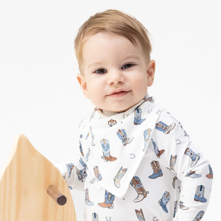 Angel Dear Buckaroo Boots Bandana Bib worn by a baby in a lifestyle view highlighting the buckaroo boots design