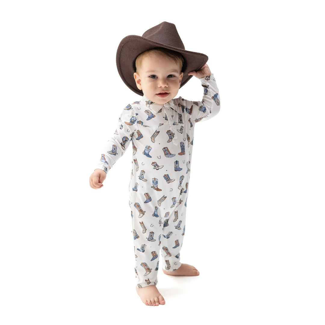 Angel Dear Buckaroo Boots Long Sleeve Cowboy Romper worn by a baby in a lifestyle view highlighting the buckaroo boots cowboy design