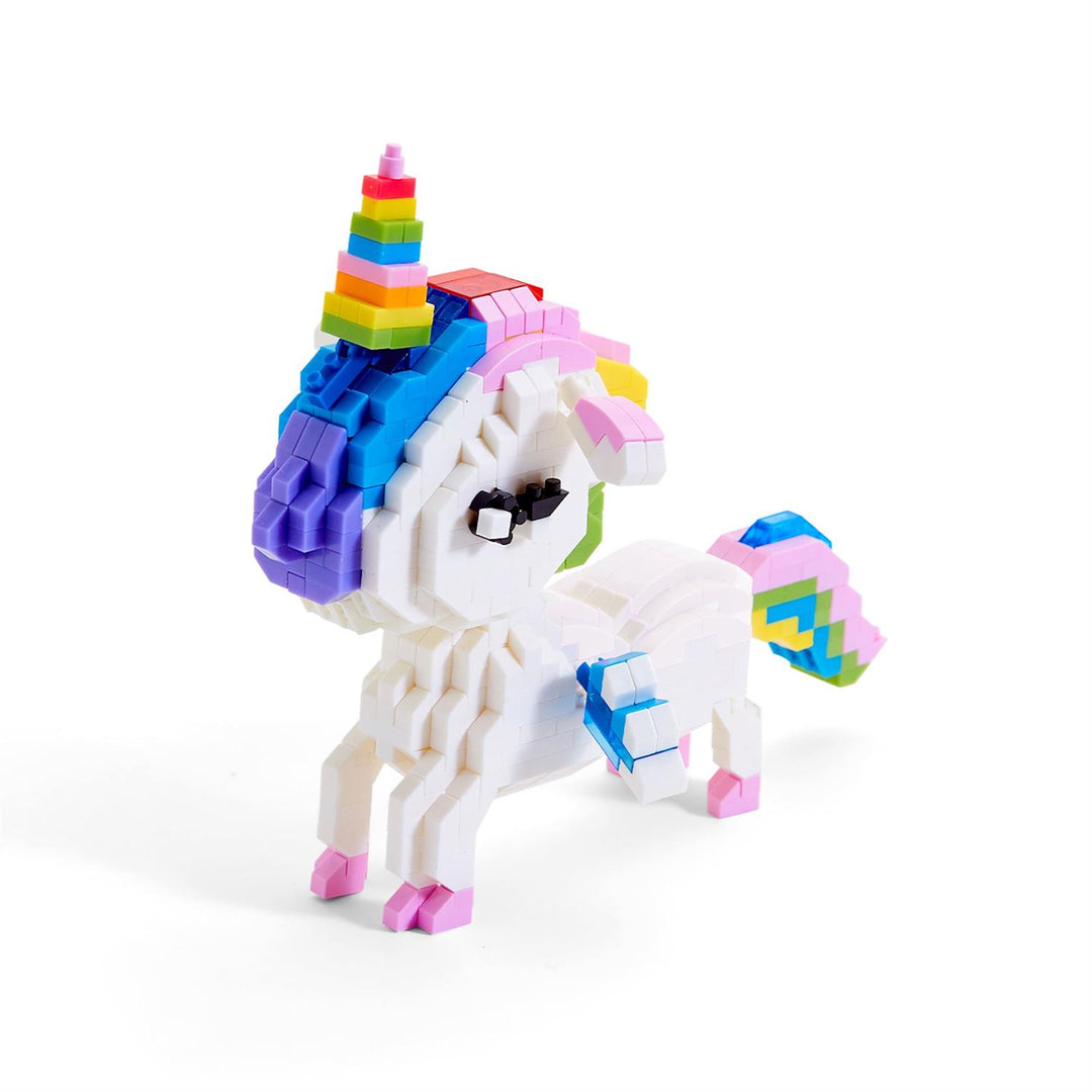 Colorful unicorn toy figure with a rainbow hat on a white background