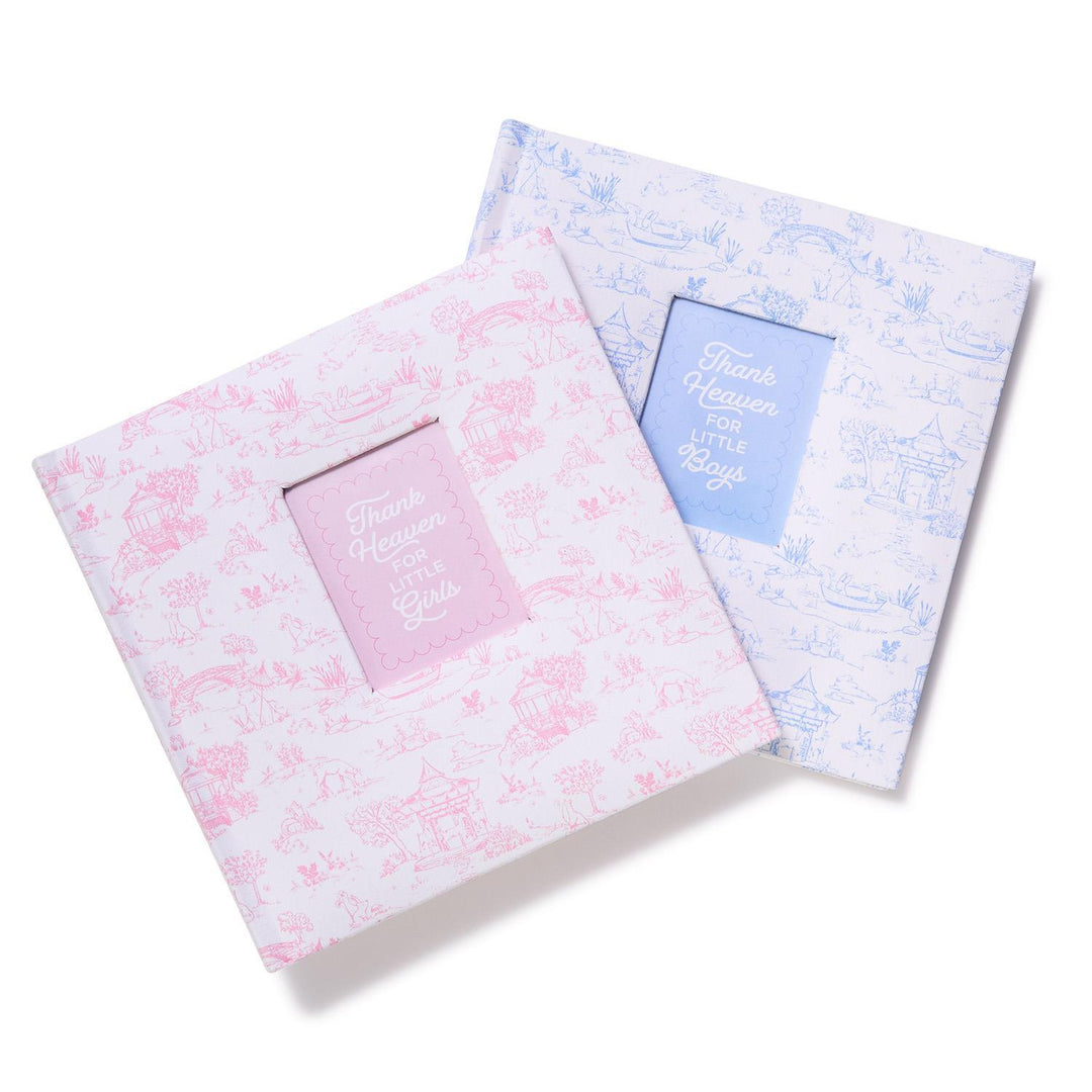 Two toile patterned photo albums on a white background