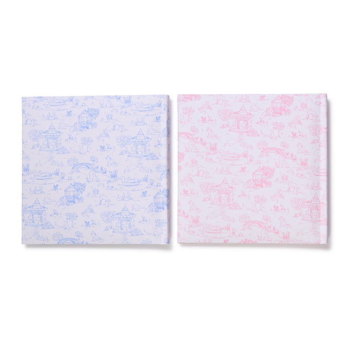 Two square photo albums with abstract patterns on a white background
