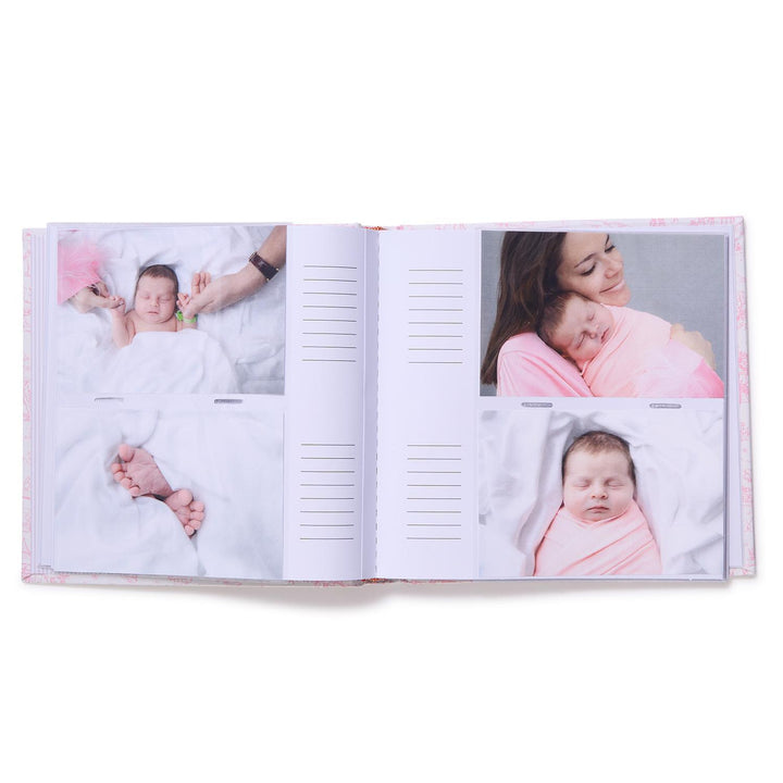 Open photo album showing images of a baby and a mother on a white background