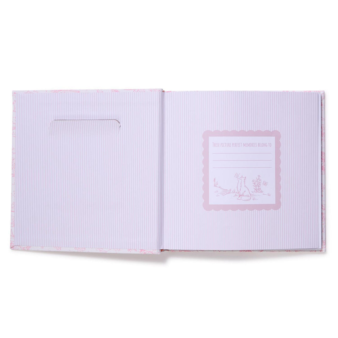 Open book with a pink logo on a white background