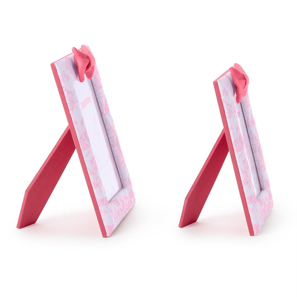 Two pink and white picture frames on a white background
