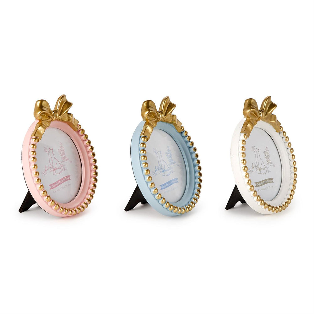 Three decorative photo frames with gold accents on a white background