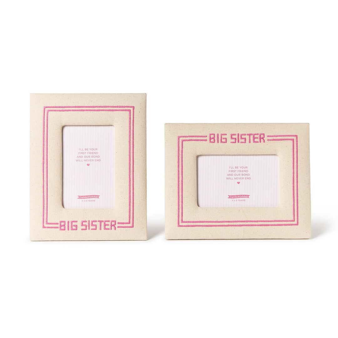 Two 'Big Sister' picture frames with pink text on a white background
