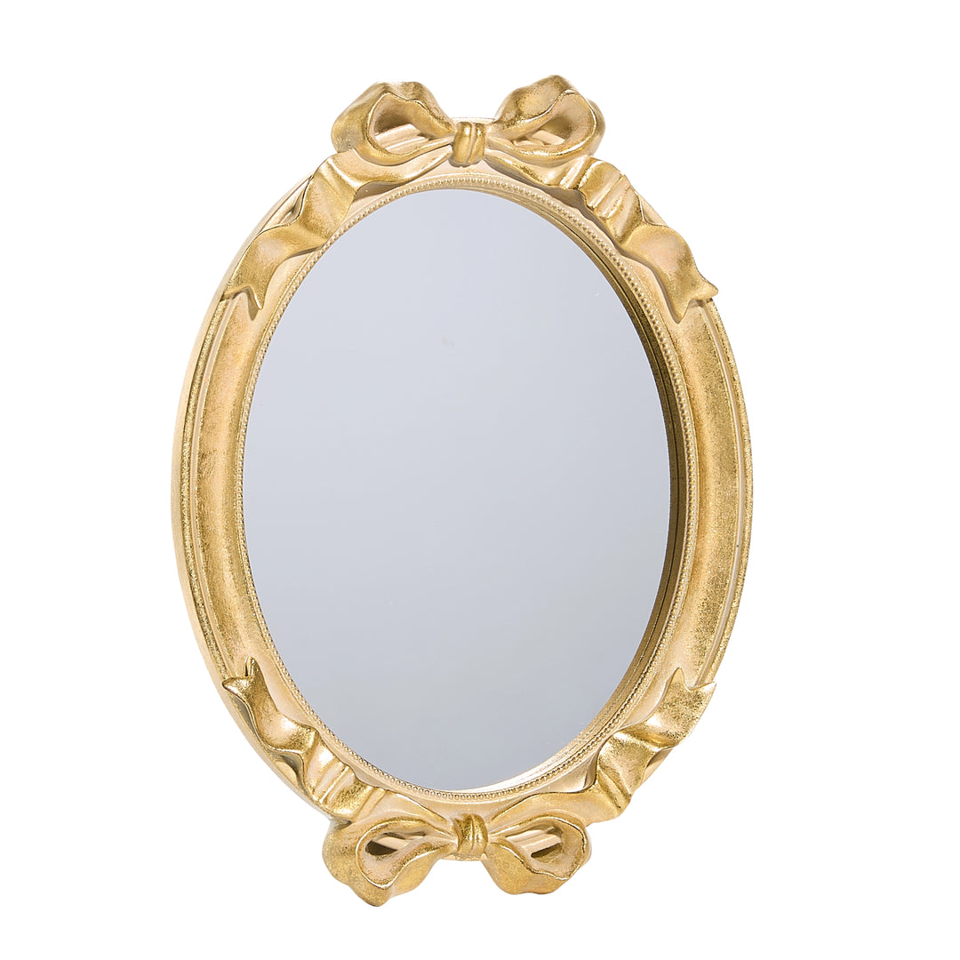 gold bow mirror with bow accents on top & bottom of mirror on white background