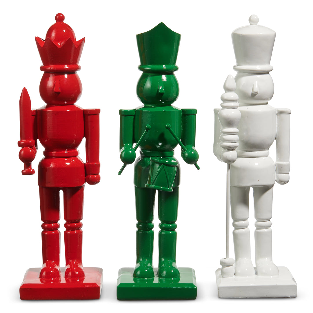 Three colorful toy soldiers in red, green, and white on a white background