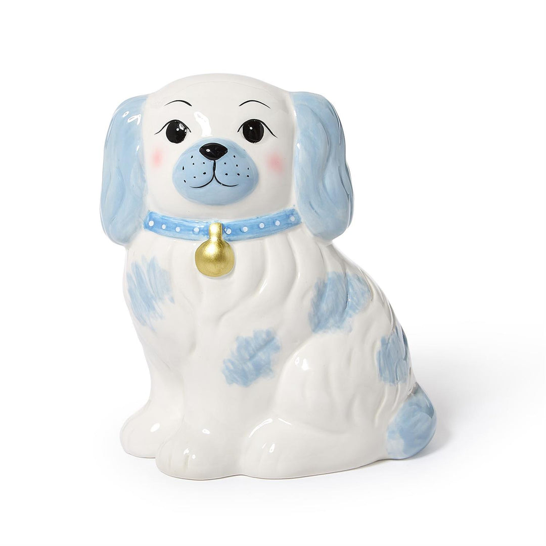 Ceramic dog-shaped piggy bank blue spots and a gold bell on a white background