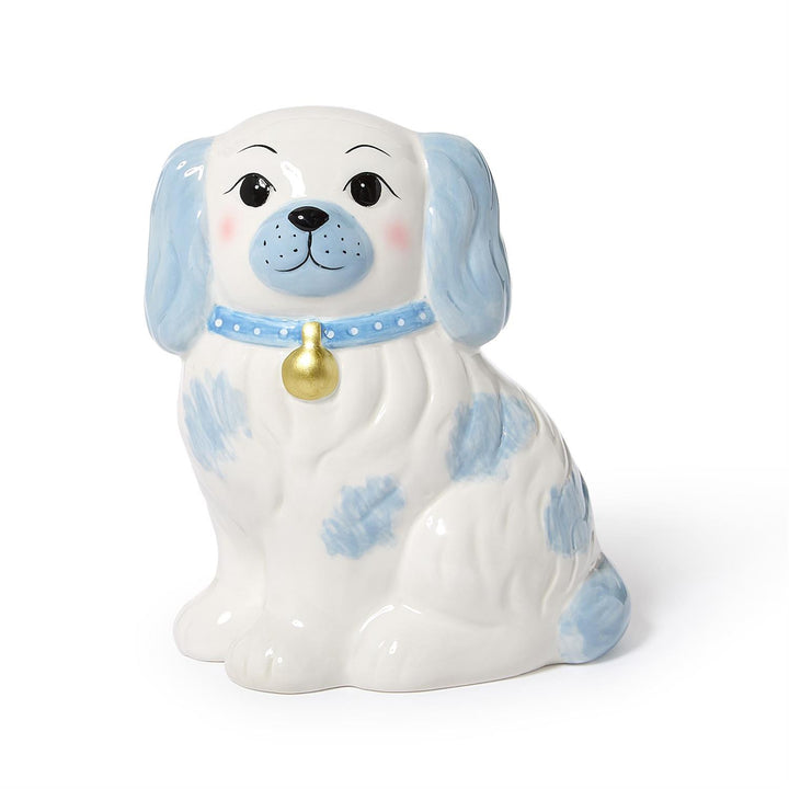 Ceramic dog-shaped piggy bank blue spots and a gold bell on a white background