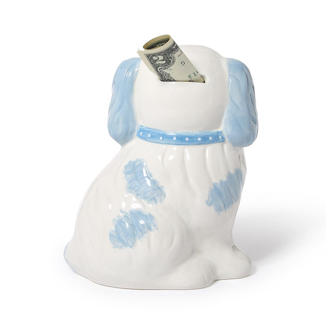 Dog-shaped money box with a dollar bill sticking out on a white background