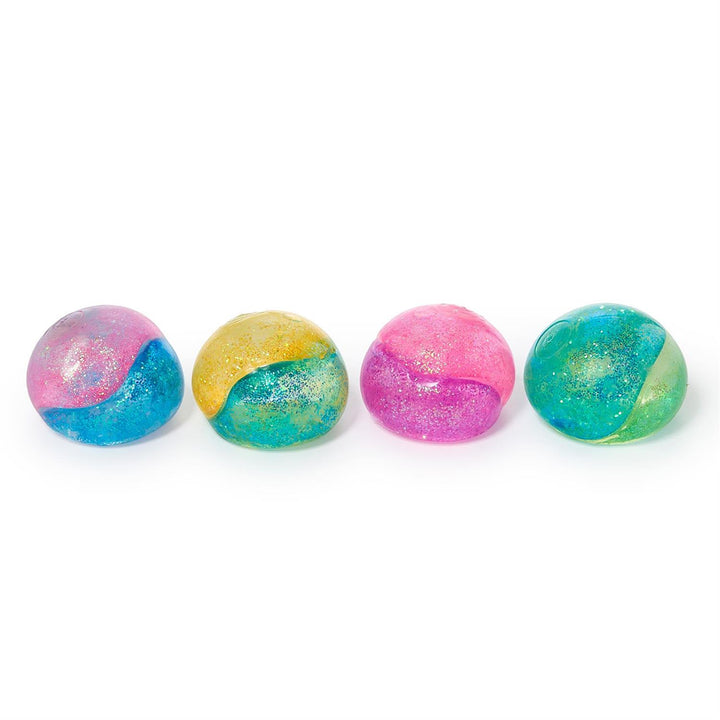 Four colorful squishys with a gradient design on a white background