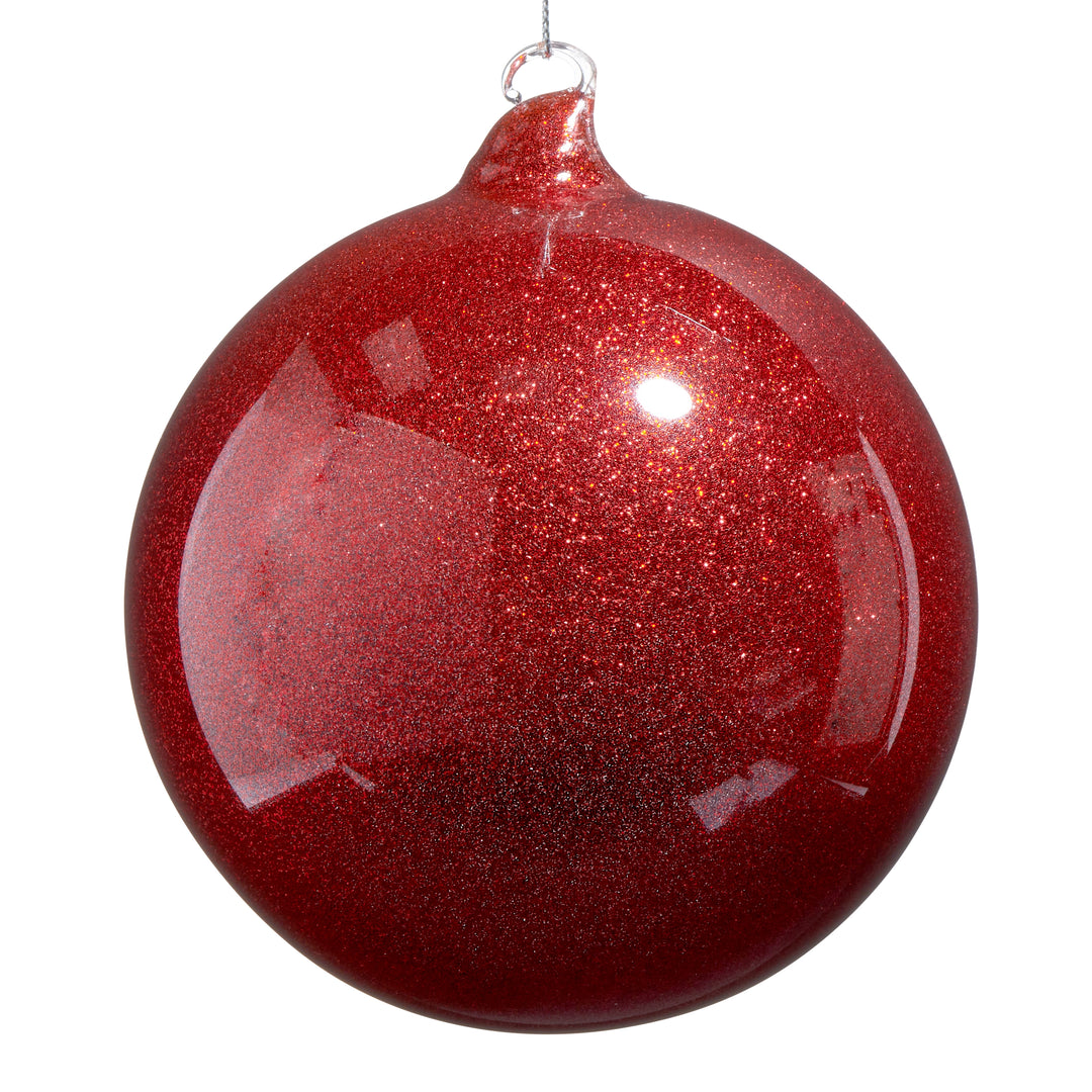 Red glittery Christmas ball ornament on a white background