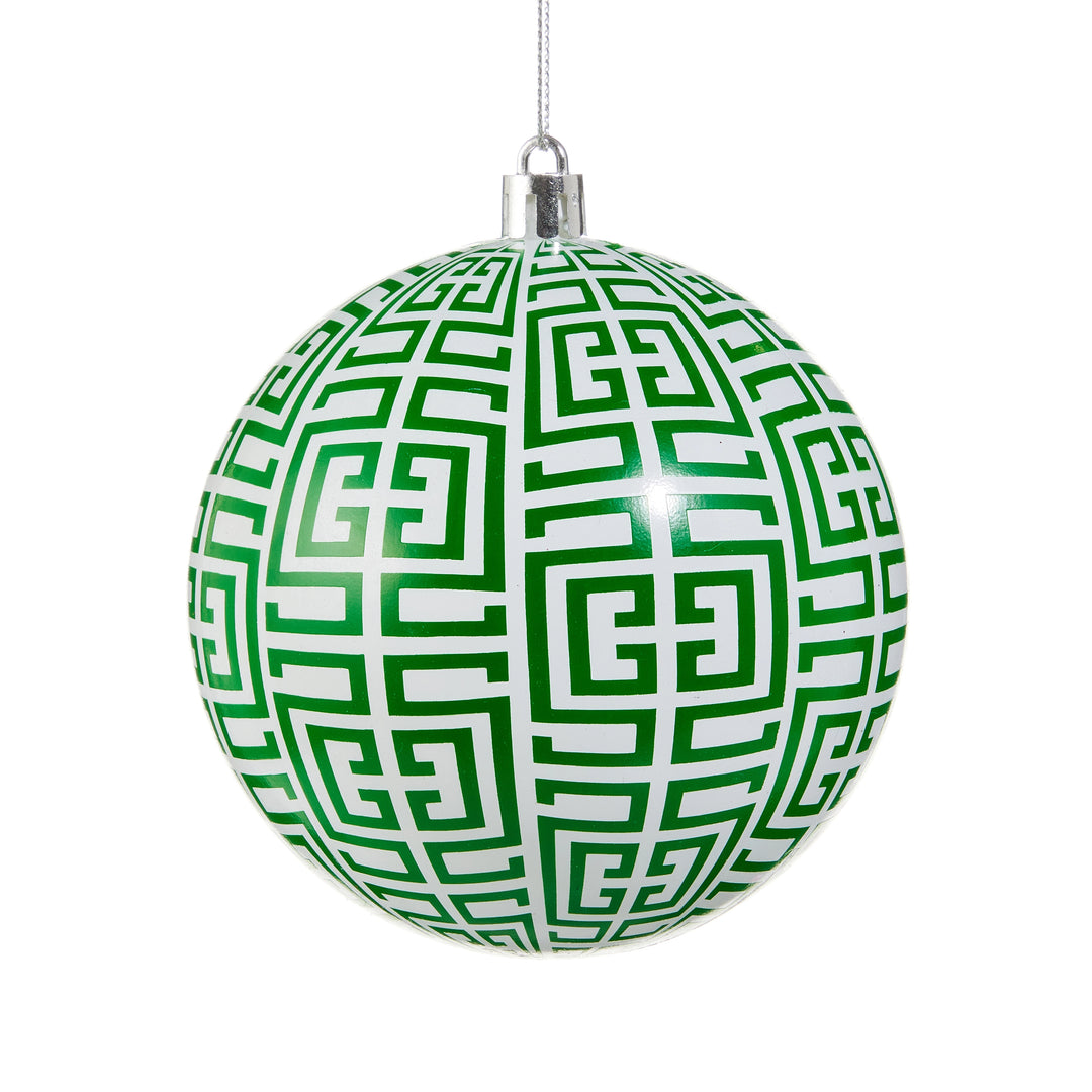 green and white greek key ornament on white background