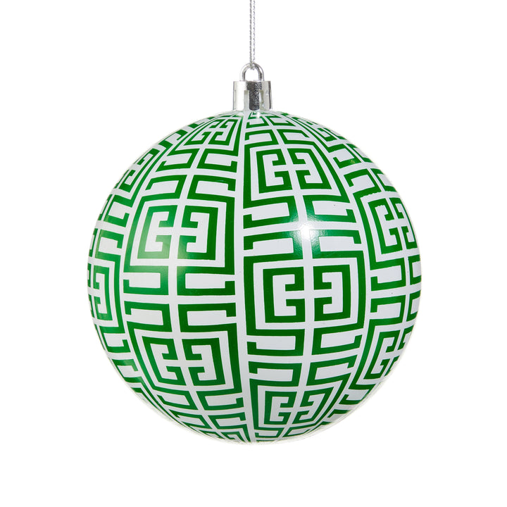green and white greek key ornament on white background