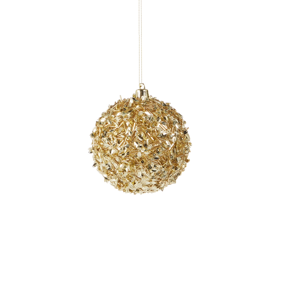 gold sequins on ornament on white background