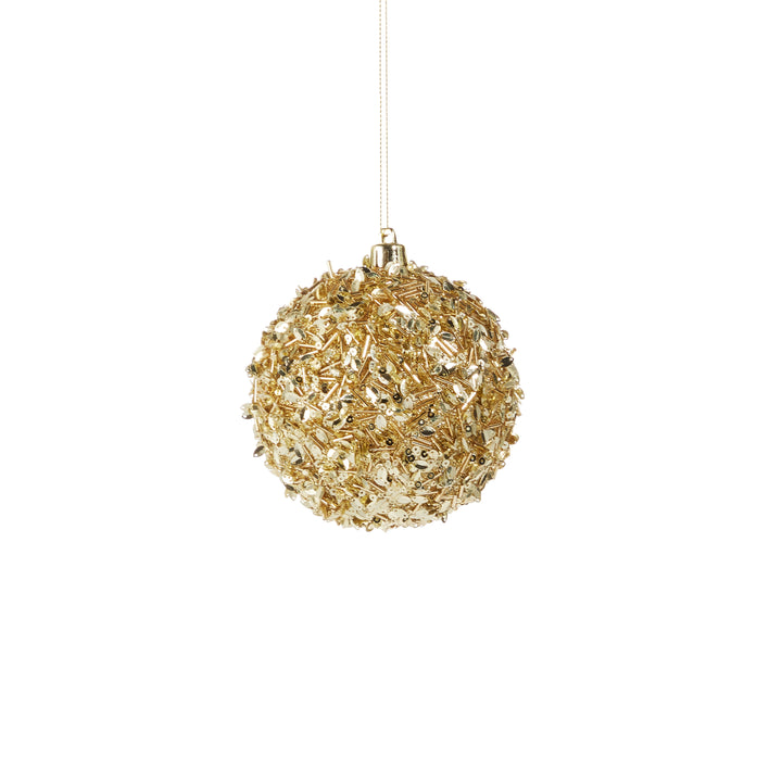 gold sequins on ornament on white background