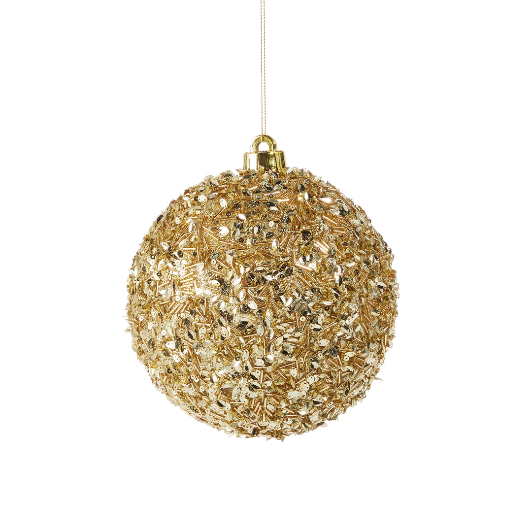 gold sequins on ornament on white background