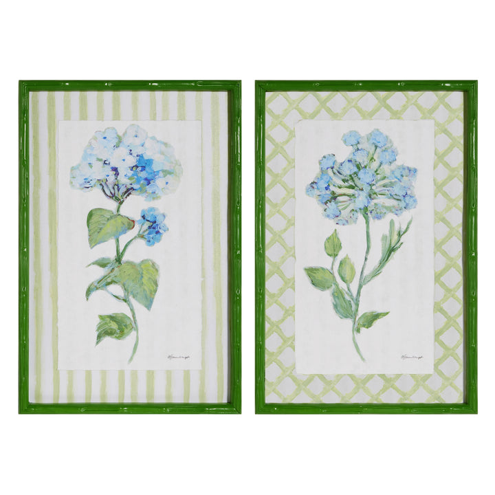 Two floral prints with green frames on a white background