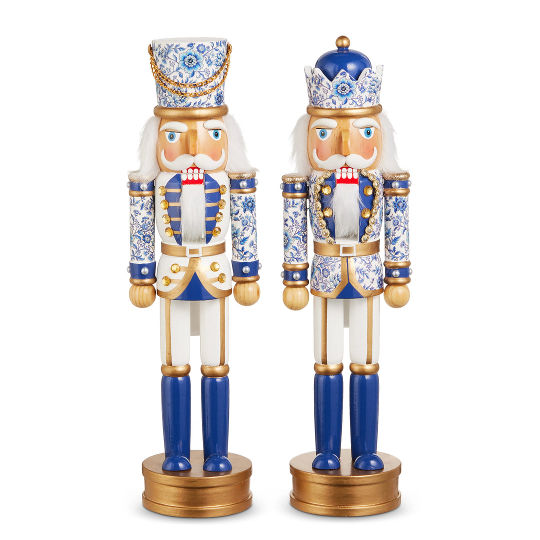 Two decorative nutcrackers with blue and gold accents on a white background